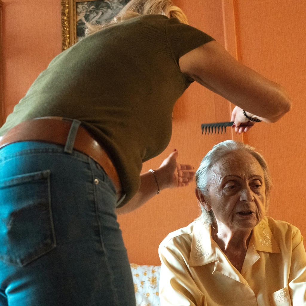 Caregiver helping elderly person